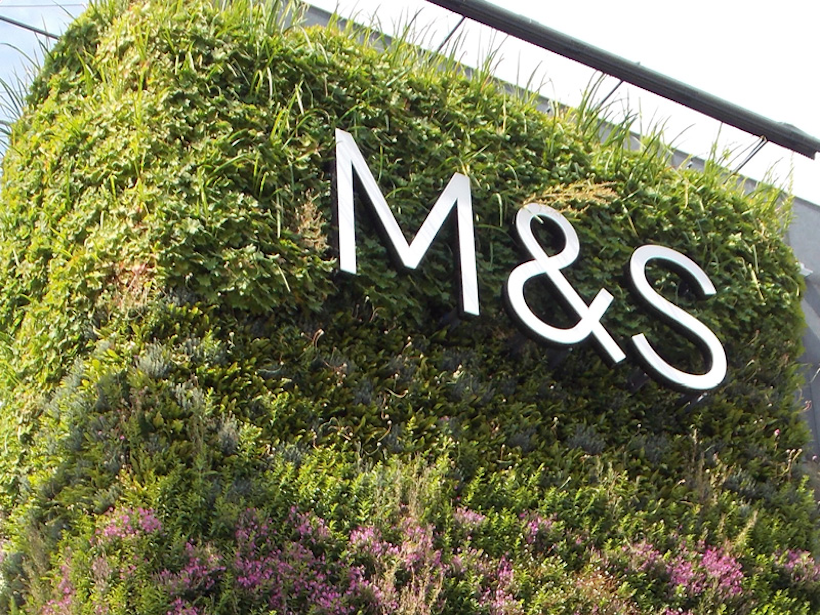 As in this example of Marks &amp; Spencer, using a sign in front of the living wall allows for accurate branding.
