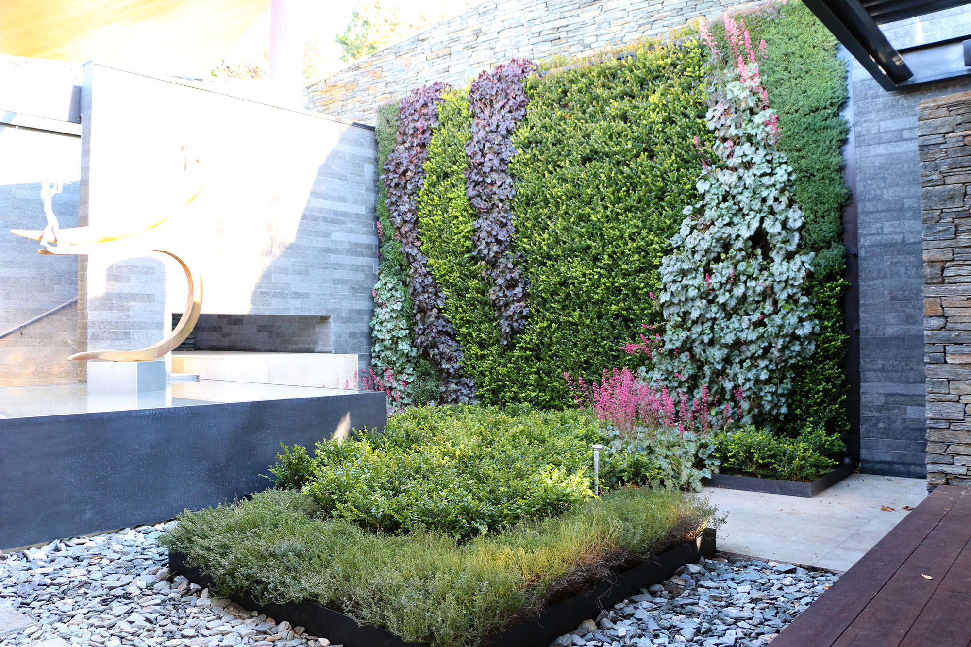 Traditional landscaping with a living wall