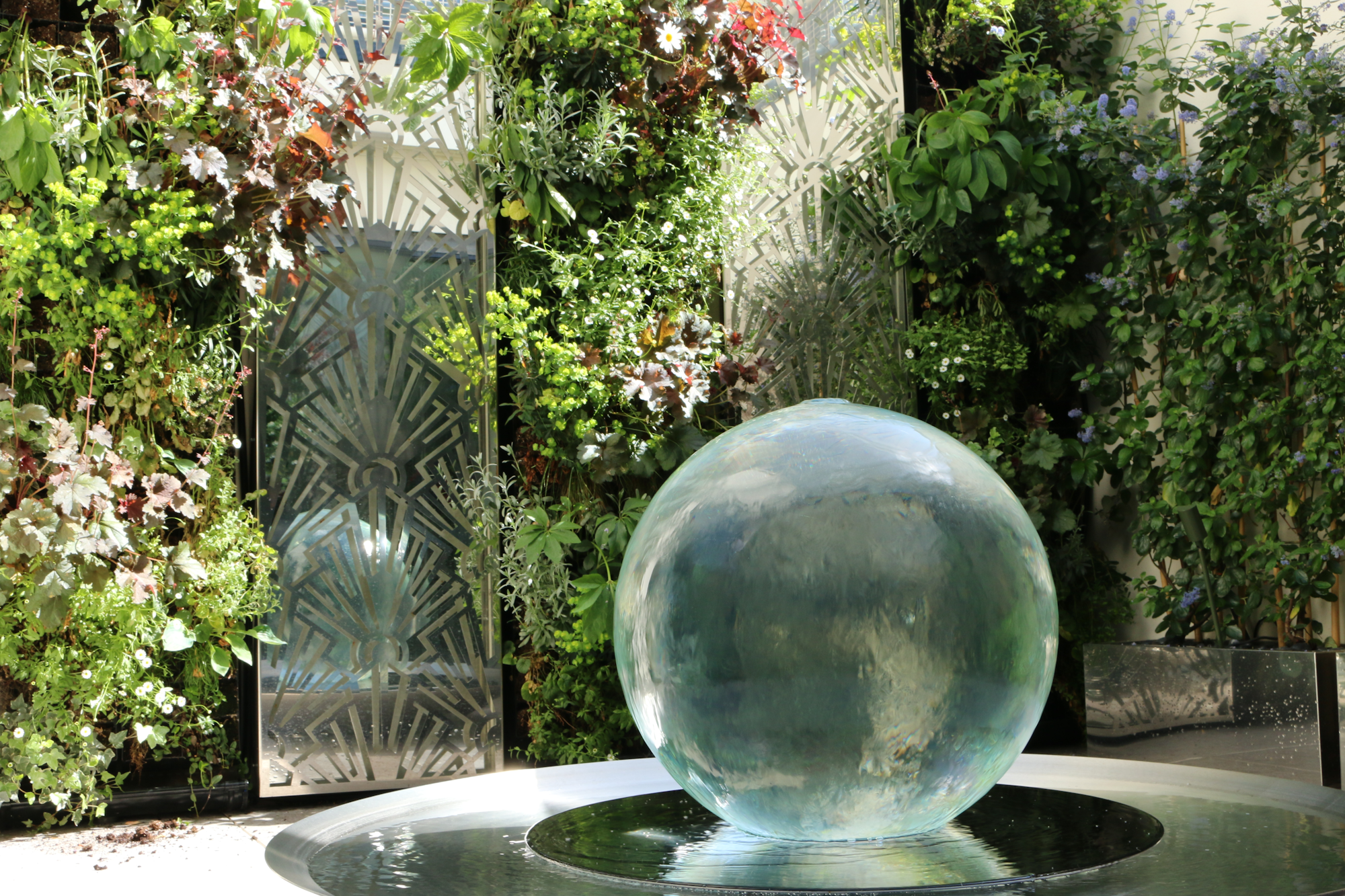Water Sphere in Front Of The Striped Living Walls