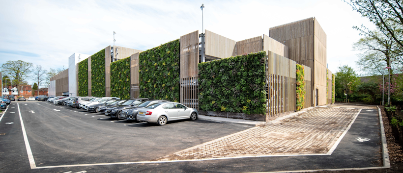 car park with timber fins and planted facade