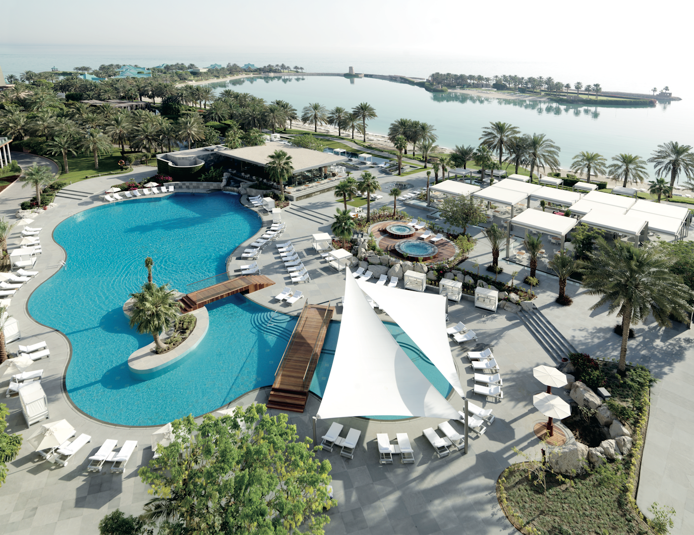 Ritz Carlton Hotel Outdoor Area In Bahrain With Pool And Greenery