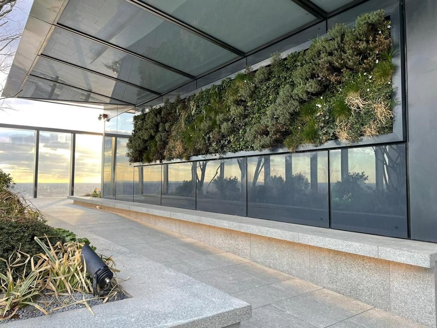 living wall and planters on a landscaped roof terrace in canary wharf