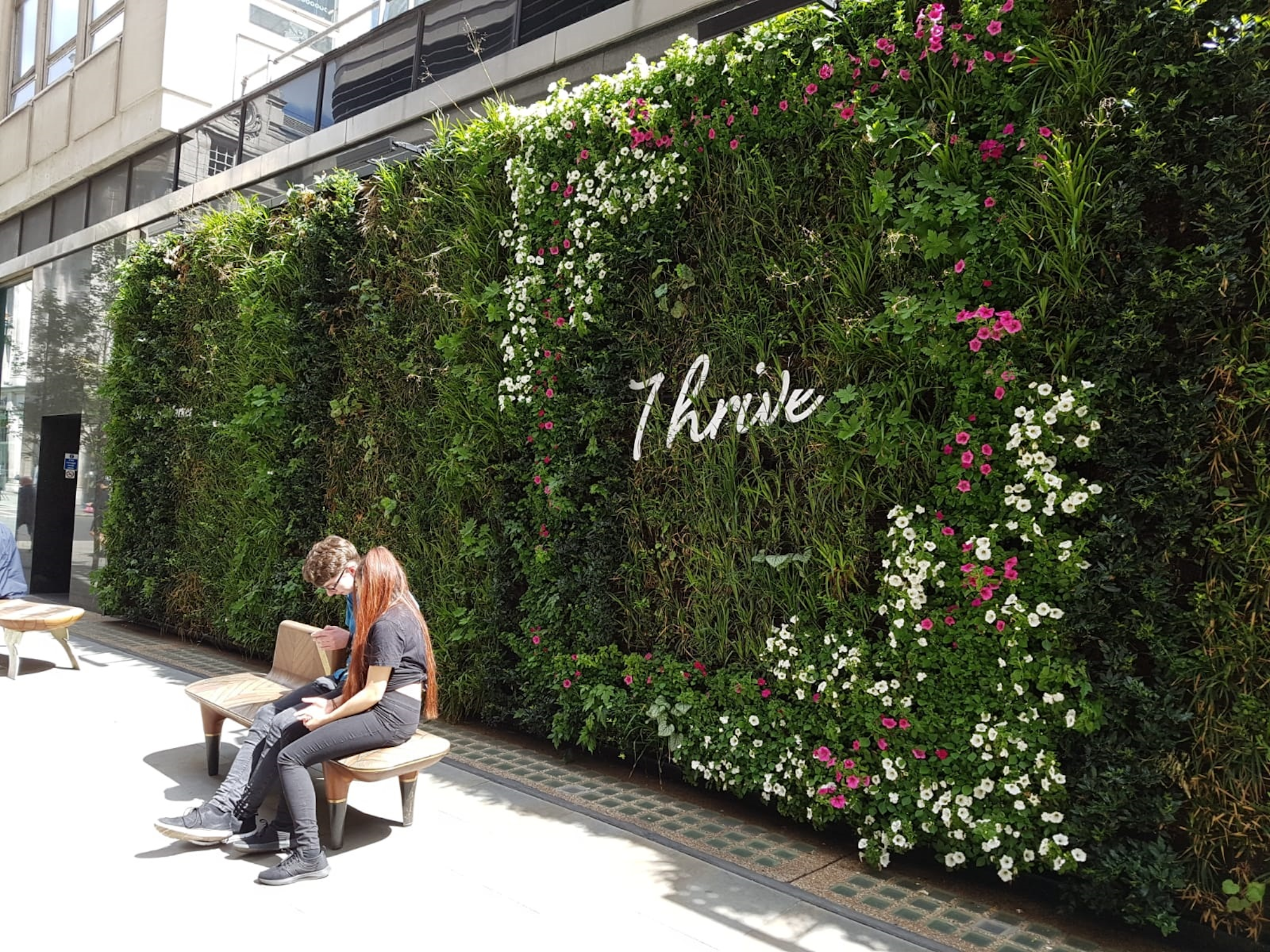 Spring At St James's Market Living Wall With Thrive Signage And Spring Flowers