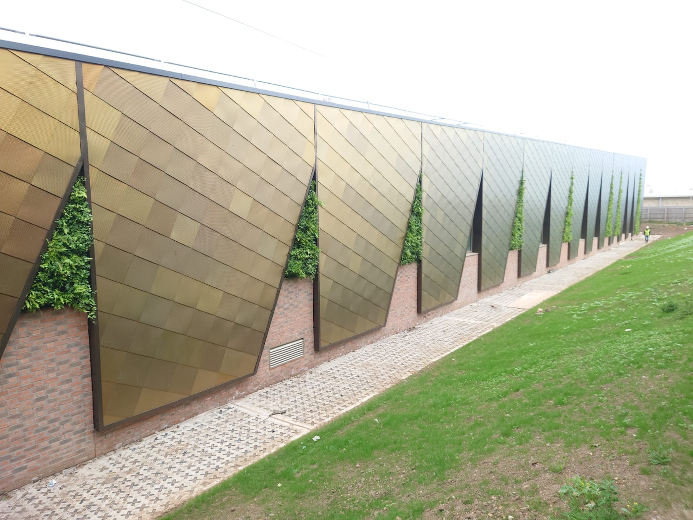 living walls on side of leisure centre building facade
