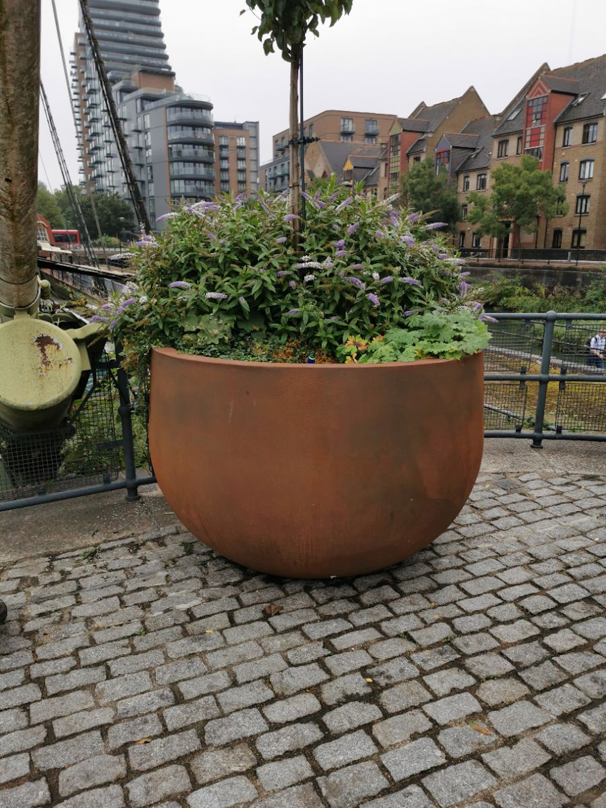 corten steel planter with tree and shrub planting