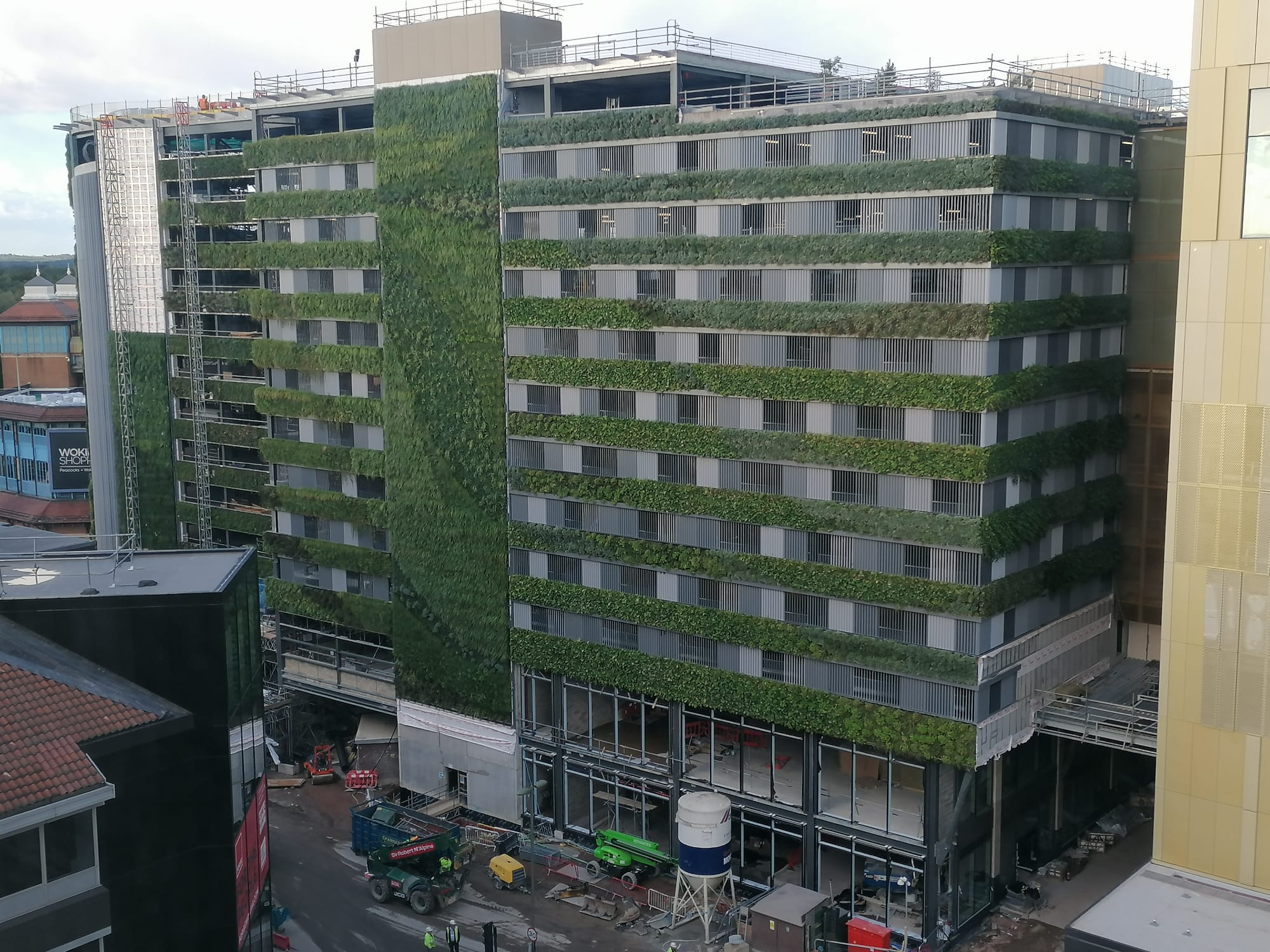 multi storey car park in construction with a living wall being installed