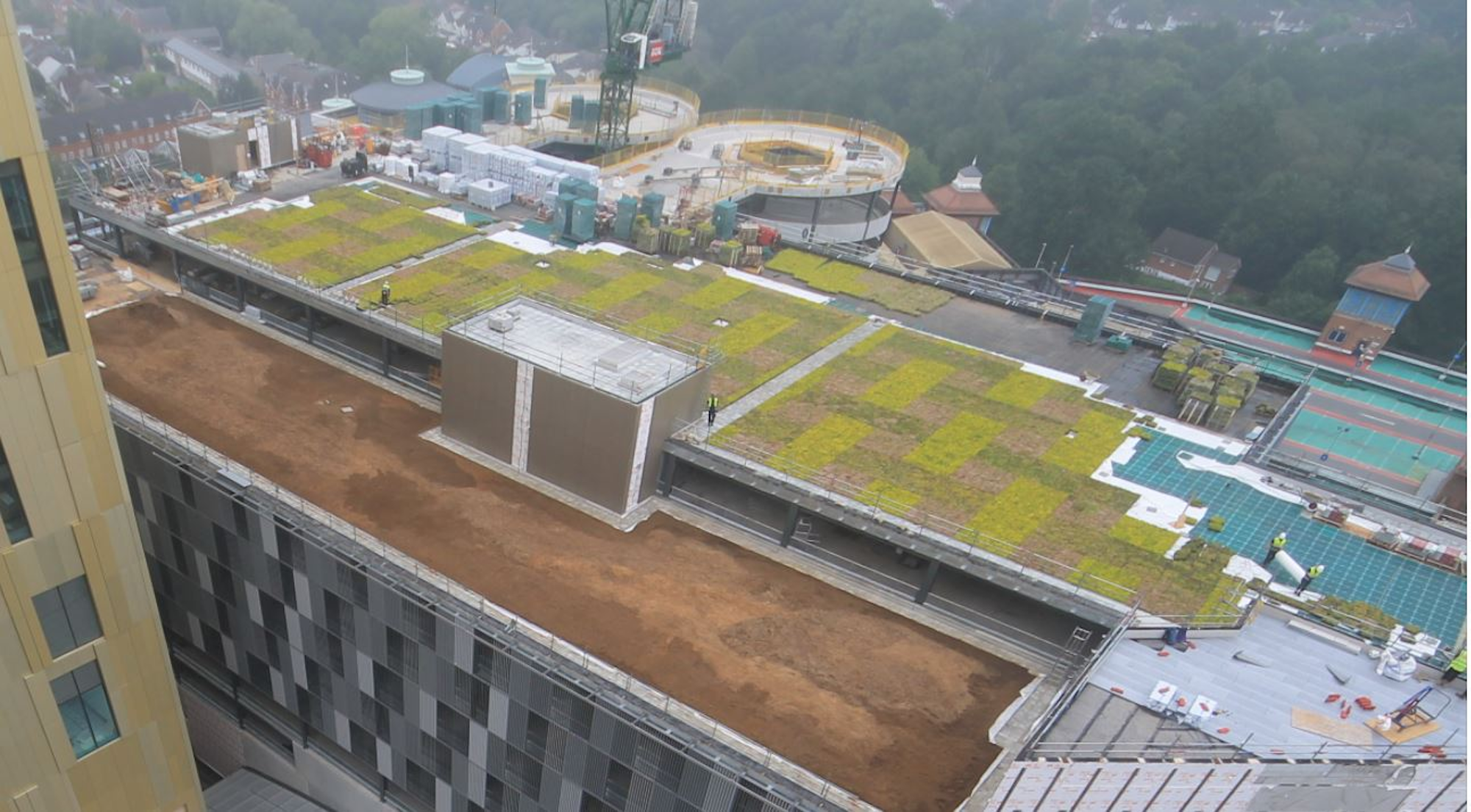 looking down at two large green roofs